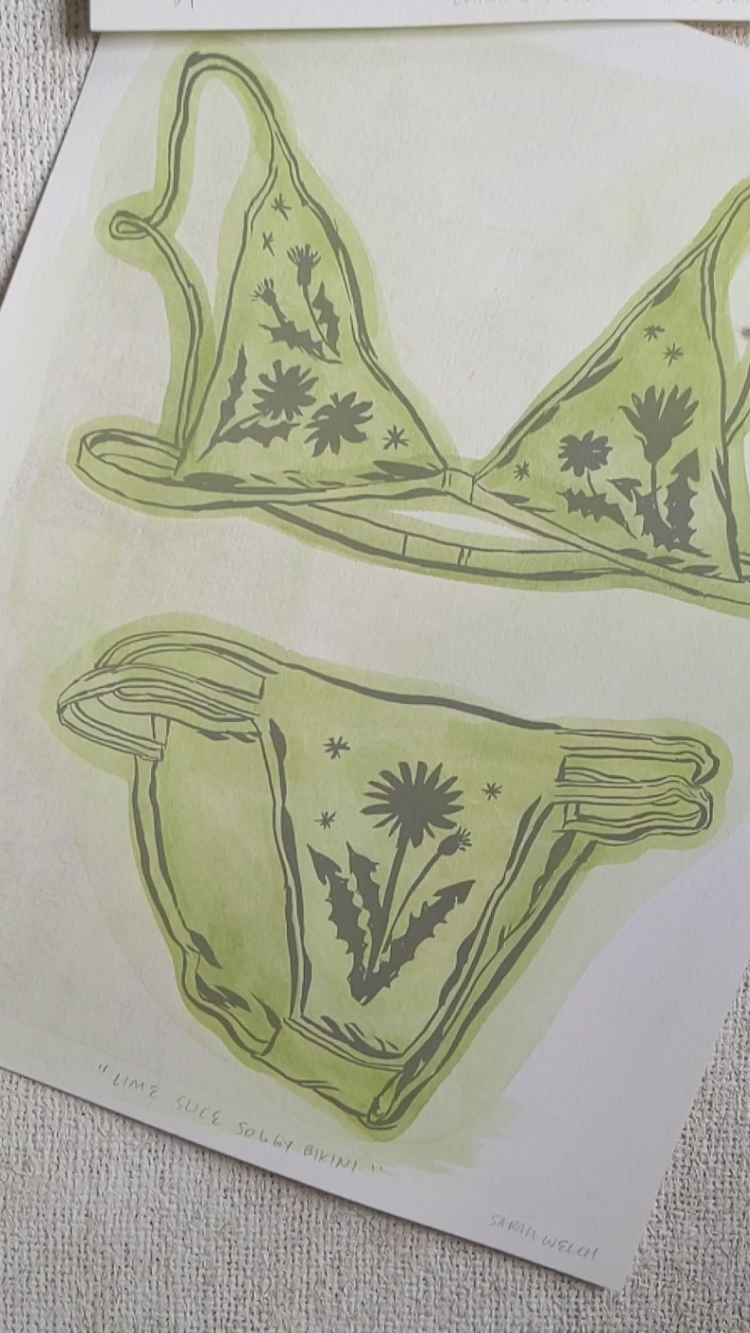 Video showing print of a bikini set with floral designs and green washy color.